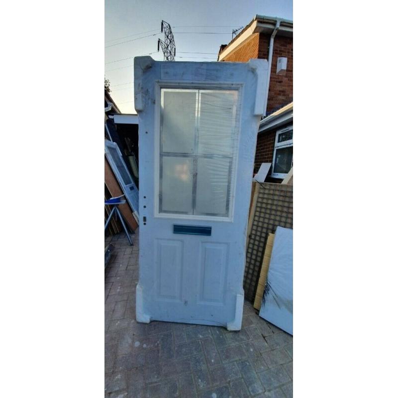 Brand new pair of double glazed doors with lead in the glass panel.