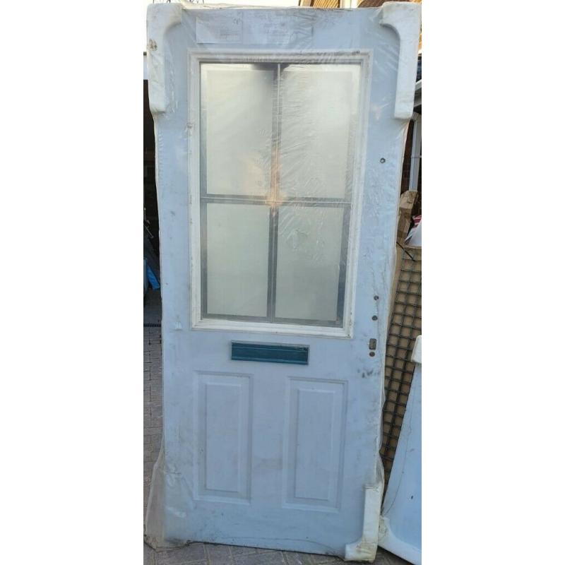 Brand new pair of double glazed doors with lead in the glass panel.