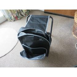 Backpack with integral folding stool.