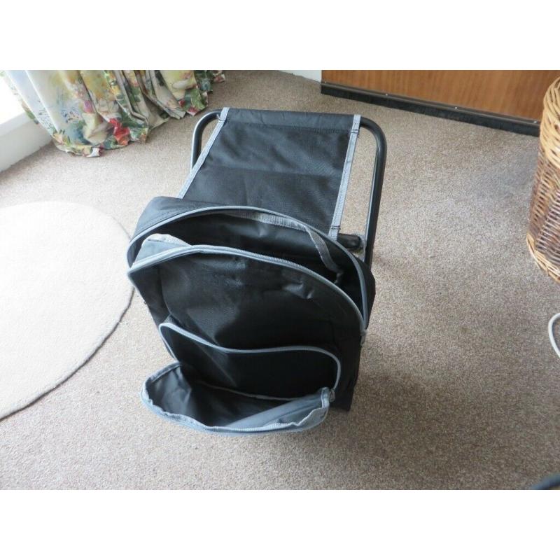 Backpack with integral folding stool.