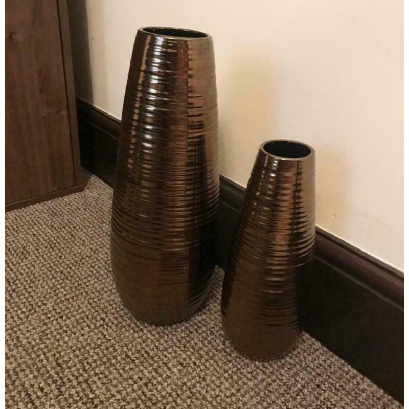 Two brown metallic vases