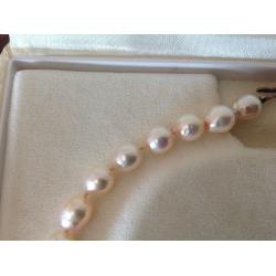 String of Cream Baroque Pearls individually knotted with 9ct Gold Clasp one owner from new