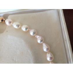 String of Cream Baroque Pearls individually knotted with 9ct Gold Clasp one owner from new