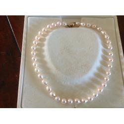String of Cream Baroque Pearls individually knotted with 9ct Gold Clasp one owner from new