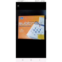 Subtrax puzzle game (peg solitaire)