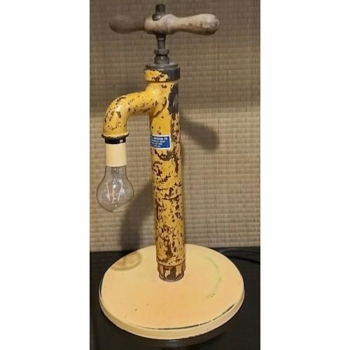 Unique industrial lamp made from a vintage water pump